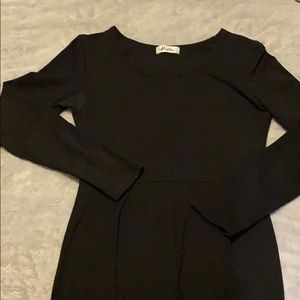 A long sleeved, black Herou dress.